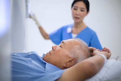 Tell viewers as much as possible about the image, using as few words as possible. Remove unnecessary words like 'the' and 'and'. Example: 'doctor wearing lab coat looking at screen' or 'guy shaving face in mirror'