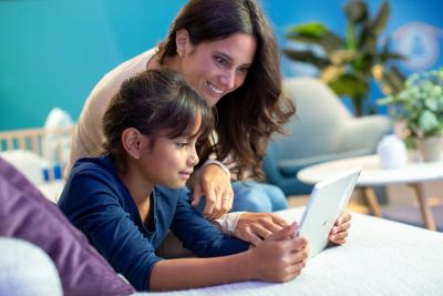 Tell viewers as much as possible about the image, using as few words as possible. Remove unnecessary words like 'the' and 'and'. Example: 'doctor wearing lab coat looking at screen' or 'guy shaving face in mirror'